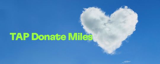 Blue background image with heart-shaped clouds on the right side. On the left, it says "TAP Donate Miles" in green.